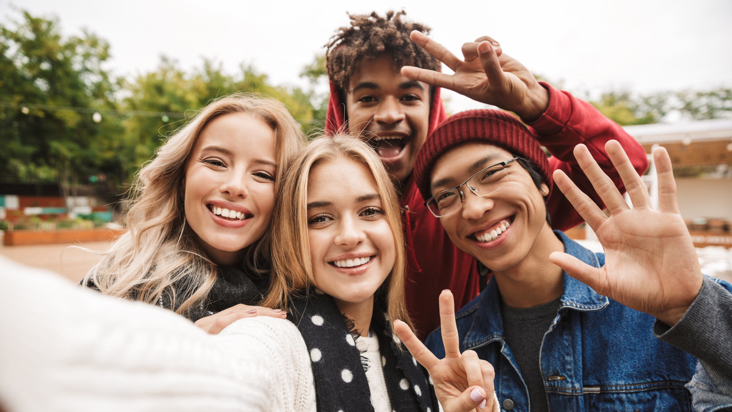 Group if cheerful multiethnic friends teenagers