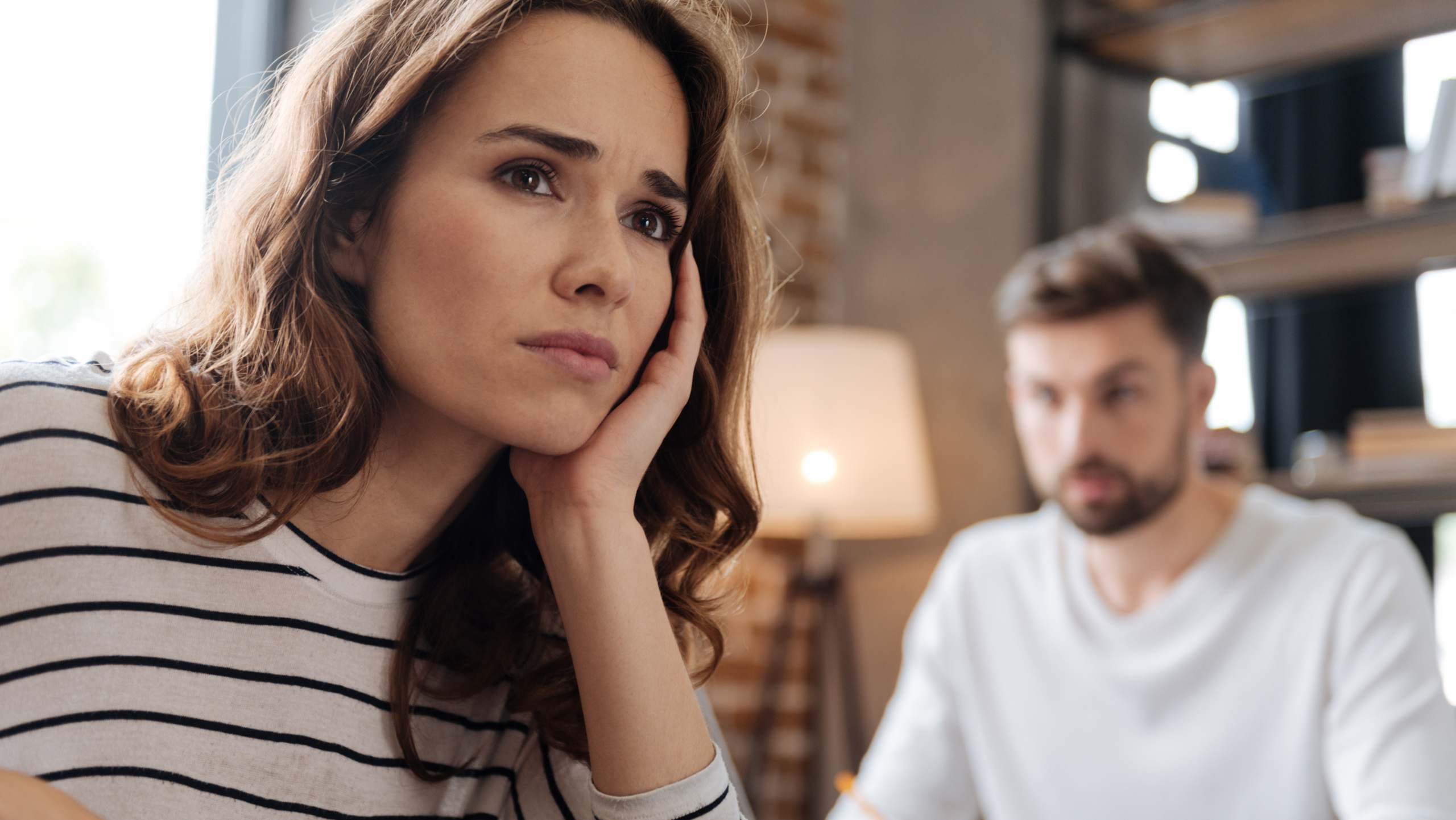 Depressed cheerless woman thinking about her problems